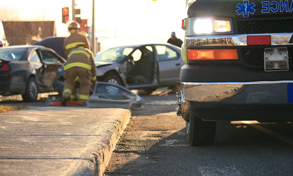 ambulance showing up at a car accident caused by distracted driving - collinsville il